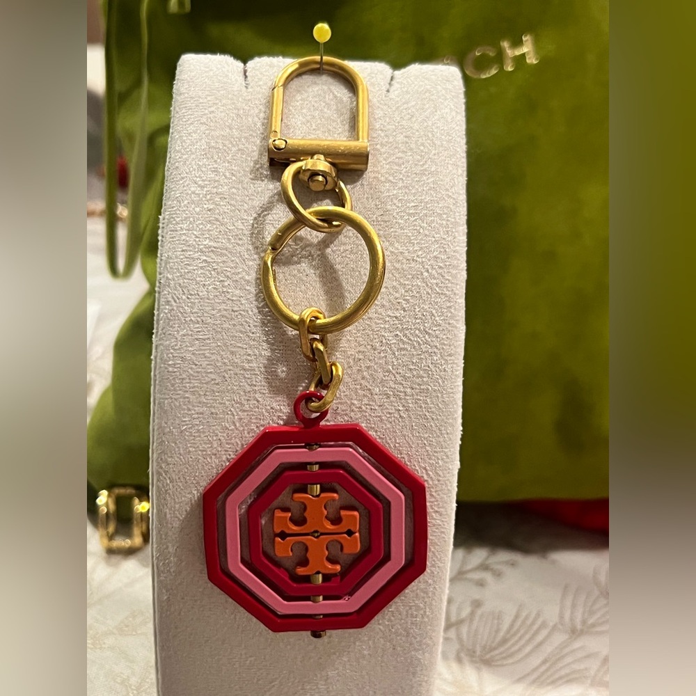 Tory Burch Rotating Geo Key Fob/bag charm in red and pink hues. - Picture 3 of 6